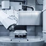 AI Toolpath Optimisation 2026 illustrated by a 5 axis CNC machining centre cutting a complex aluminium aerospace component