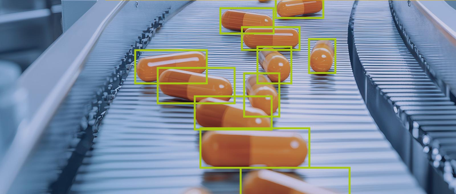 MVTec HALCON 26.05 AI object detection software identifying capsules on a high-speed pharmaceutical production line using machine vision technology