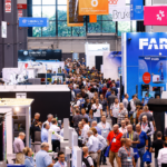 IMTS 2026 industrial AI trade show floor with manufacturers exploring AI CNC technology, CAM software, machine tool automation, metrology systems and smart manufacturing solutions