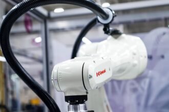 Kawasaki Physical AI Robot 2026 RL030N industrial robot arm demonstrating adaptive factory automation, robotic inspection and AI-controlled production handling at Automate 2026.