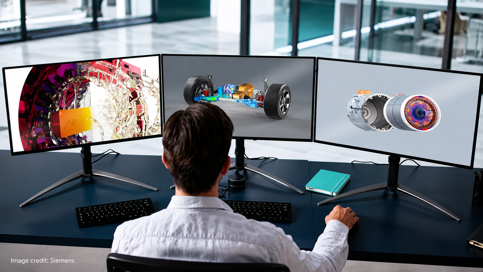 Engineer using Siemens AI-Powered Simcenter simulation software across three monitors to analyse vehicle chassis, motor and fluid dynamics designs before manufacturing