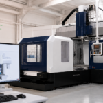 Nidec NC Twin digital twin platform for CNC machining, showing Nidec Machine Tool MVR Series double-column machining centre with virtual NC programme simulation for machine operation, cycle time verification, interference checking and surface quality prediction