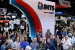 IMTS 2026 industrial AI exhibition at McCormick Place with manufacturing professionals, CNC machine tool stands and automation technology on the show floor